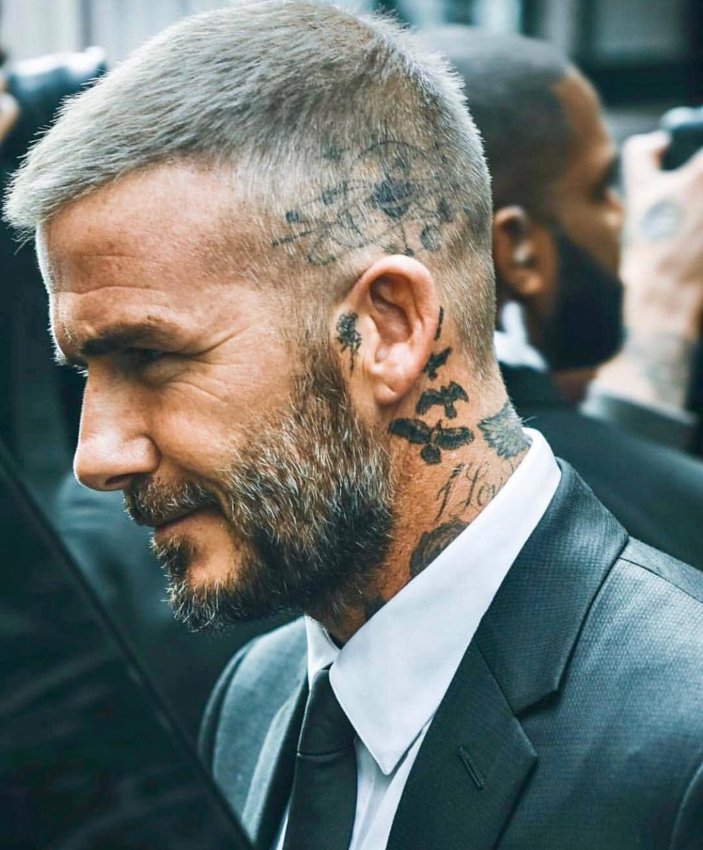 Oh no. Poor David. His kids have scrawled all over his head in biro.