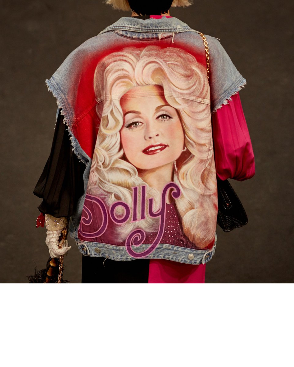 In a tribute to the most honored female country performer Dolly Parton, a  sleeveless denim jacket with her image on the back, a two tone shirt and  leggings, from the #GucciSS19 fashion, image size:960x1200
