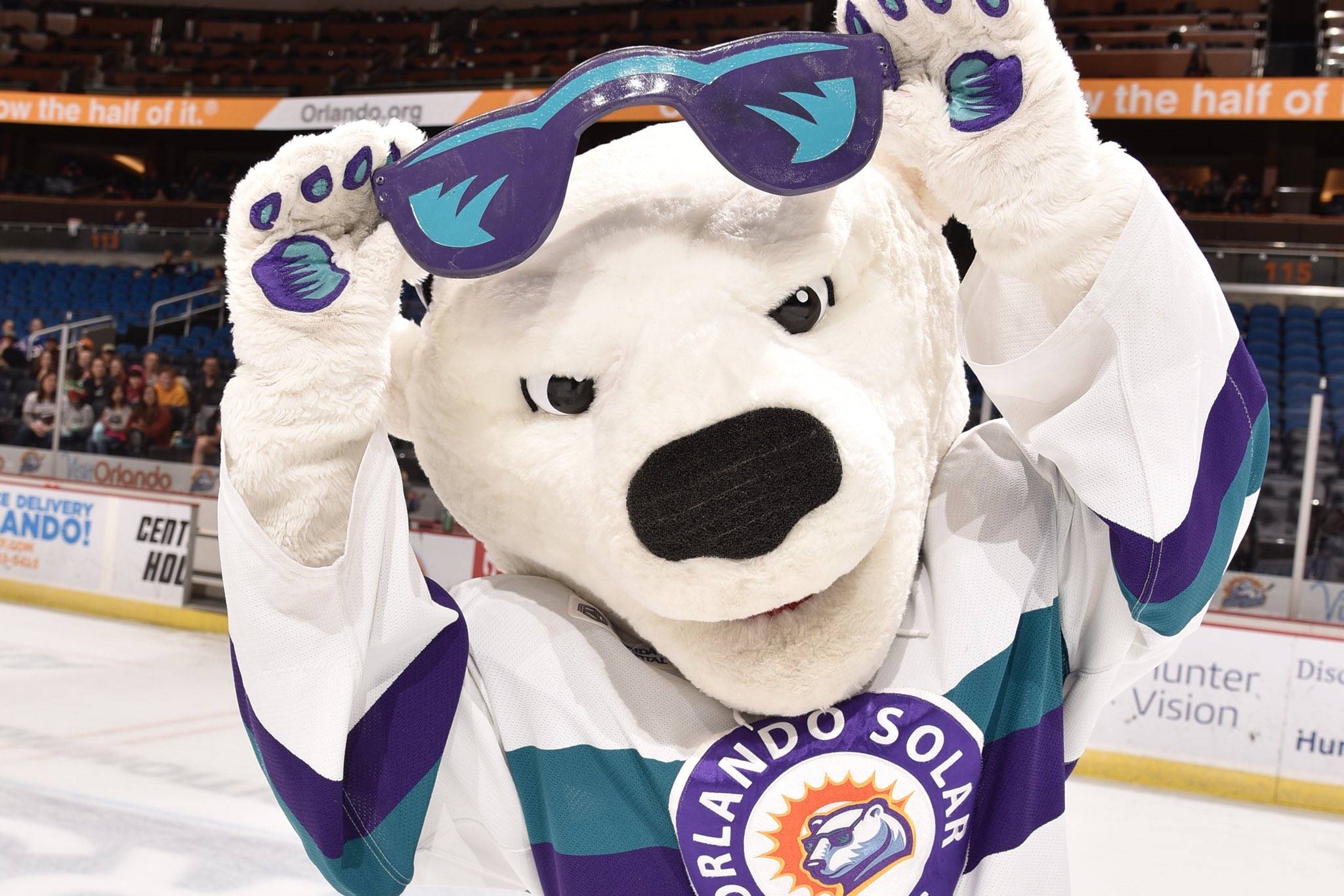 Shades the Orlando Solar Bears' mascot gives out blankets at Daily