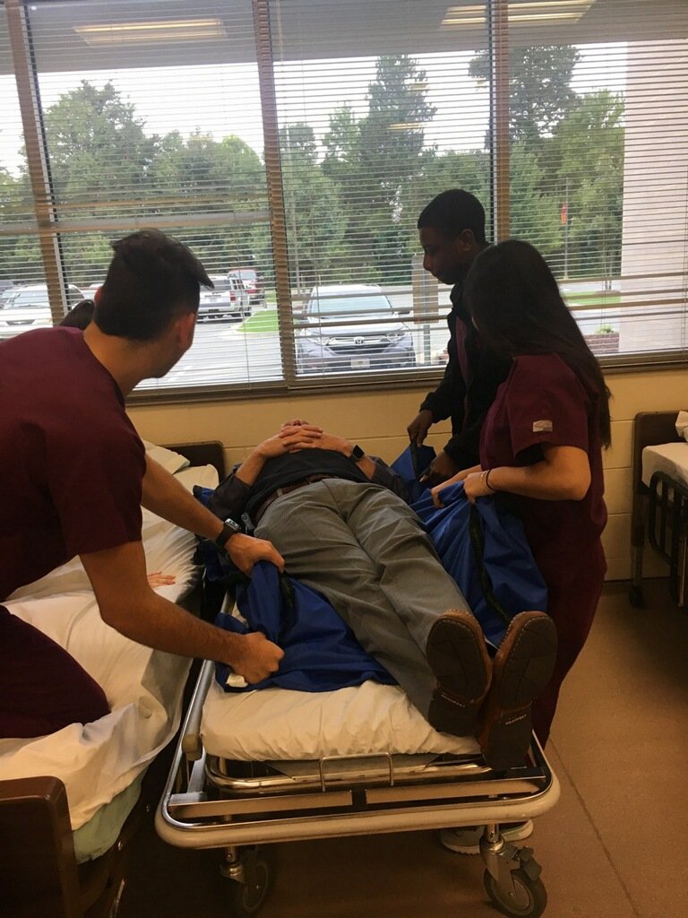 CTEC_ABSS's tweet image. Part of leadership is modeling.  Today I got to be the patient for our Nursing Fundamental students as they practiced patient transfer skills.  I always knew I would be in great hands.....