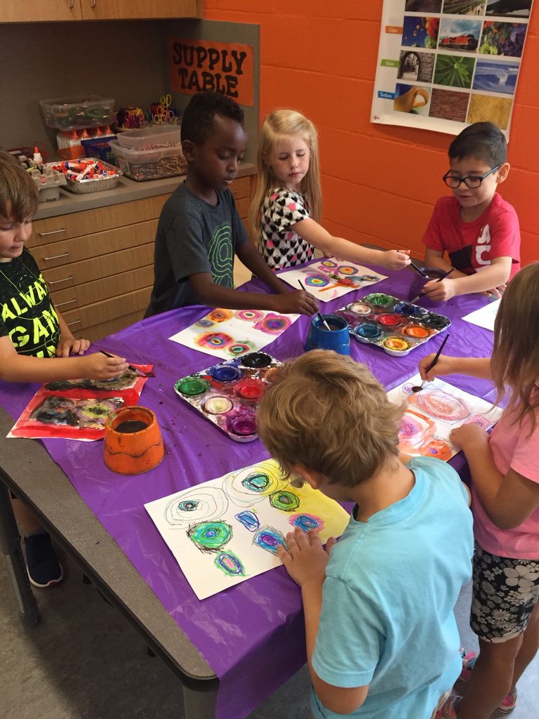 Love my new art room! 1st Grade using wax resist on their concentric circles.#dobbslearns @#risdfinearts