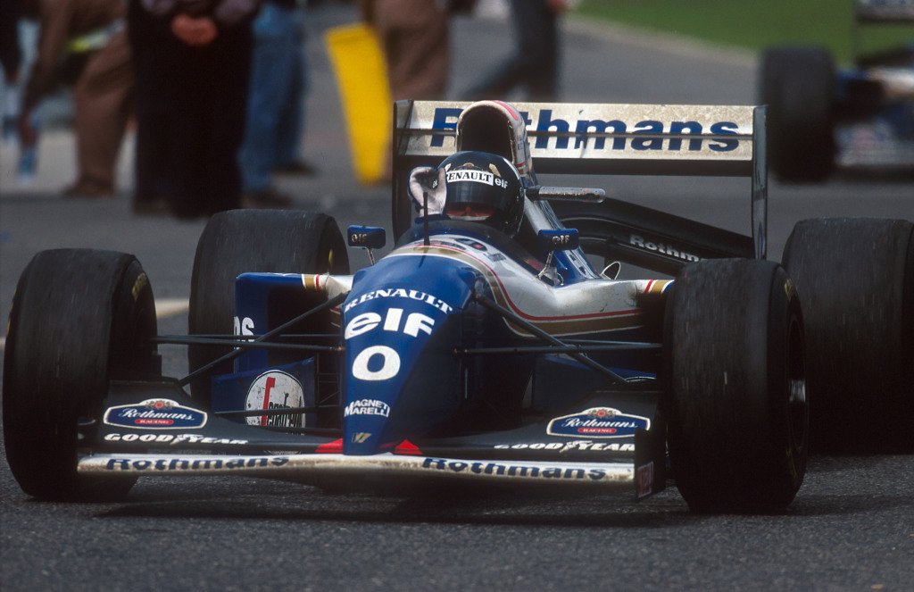 Damon Hill celebrates winning the 1994 Portuguese Grand Prix.