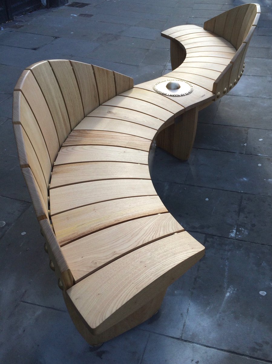 Memorial bench for Hollie Gazzard on the street in Gloucester made from English sweet chestnut. At its centre there is a brass ‘witness globe’ spin this as an act of support #holliegazzardtrust #memorial benches #matthewburtstudio