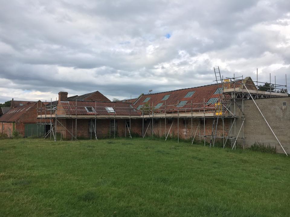 askscaffolding's tweet image. Scaffolding erected on a barn for re-roofing with a beamed section to span over an outbuilding with a fragile roof in Swinton.