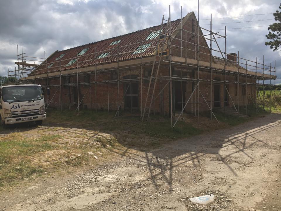 askscaffolding's tweet image. Scaffolding erected on a barn for re-roofing with a beamed section to span over an outbuilding with a fragile roof in Swinton.