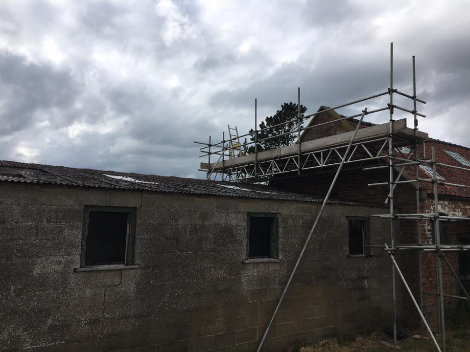 askscaffolding's tweet image. Scaffolding erected on a barn for re-roofing with a beamed section to span over an outbuilding with a fragile roof in Swinton.