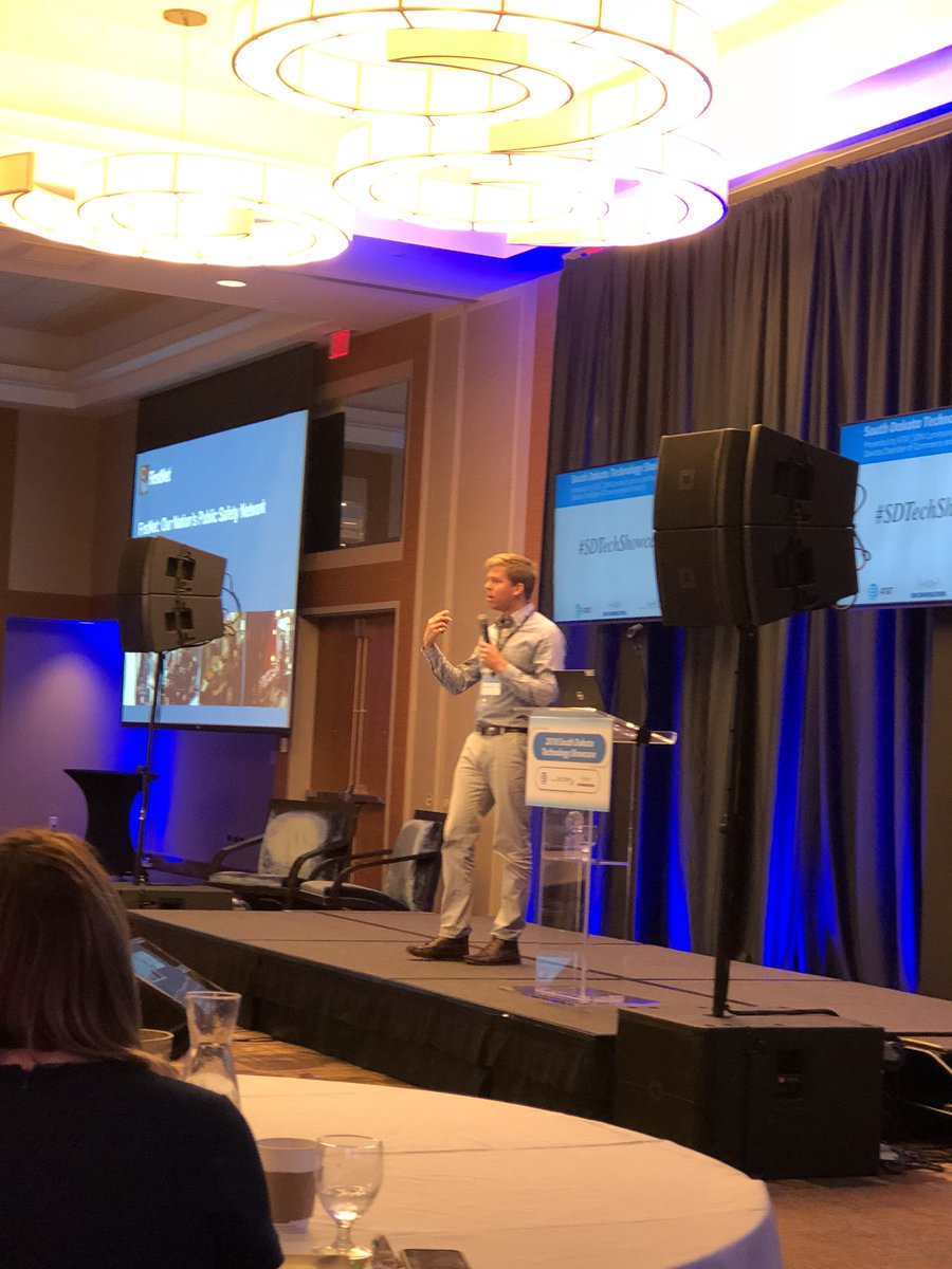 NATEsafety's tweet photo. @EdPFirstNet from @FirstNetGov hits the stage to speak at the 2018 South Dakota Technology Showcase in Sioux Falls, South Dakota! #SDTechShowcase #ElevateWireless #FirstNet https://t.co/mRVoarY8x3