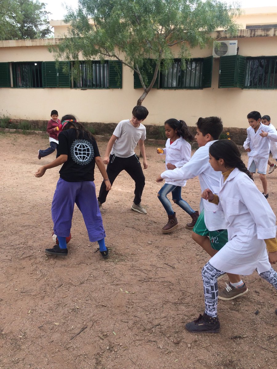 AELhighschool's tweet photo. Emiliano and Feli playing football in Cerro Colorado. #aelincolnsl #aelincoln #ael https://t.co/XGMTeNmW3j