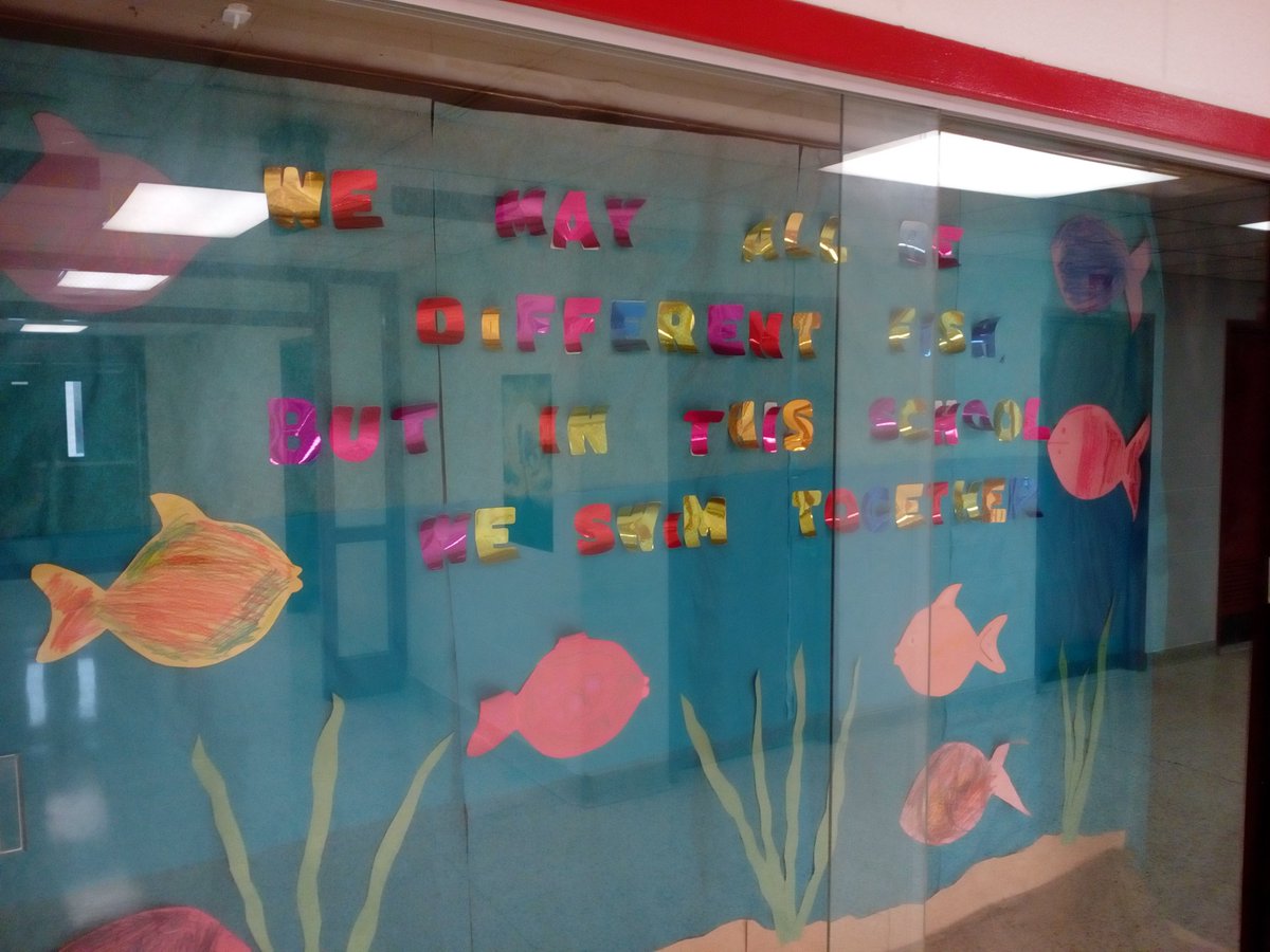 TechSchauer's tweet image. I was walking the halls after school the other day and I was inspired by this display case that reads "We may all be different fish, but in this school we swim together."  This saying promotes unity of the students and the value of working together.  #NRNT1819   #NRCSDchat