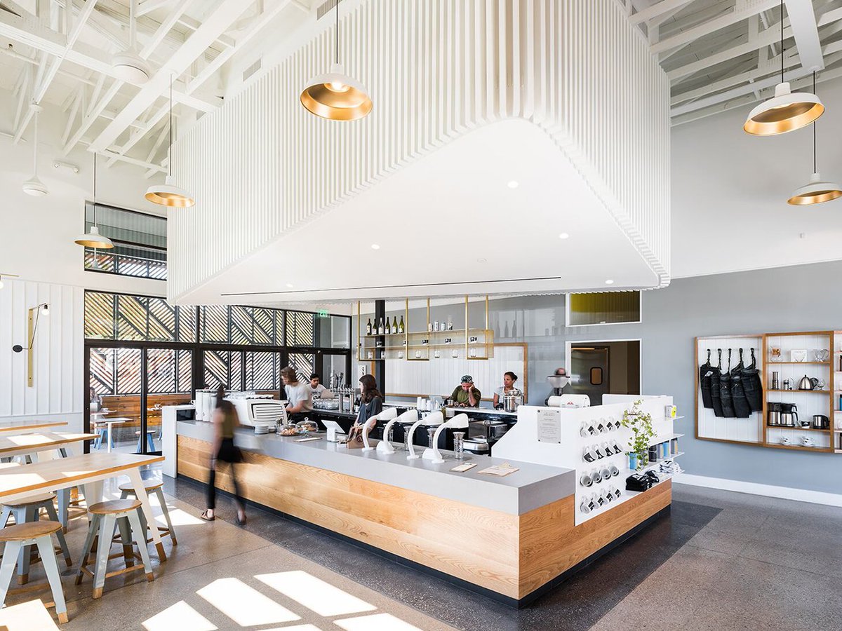 CaesarstoneUSA's tweet photo. #PSA: @HoundstoothDTX  is serving up hot #coffee and a #modern design, thanks to Dallas design firm, Official and a few slabs of 4004 Raw Concrete. 📷 by Robert Yu https://t.co/VrFLmkUNzc