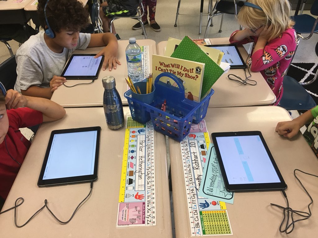 1st grade using iPads to take the MAP assessment- so much concentration and hard work!  I wish I had cool headphones too!