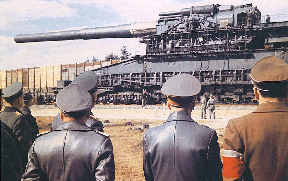 Adolf Hitler (second from right) and Albert Speer (right) in front of the 8...