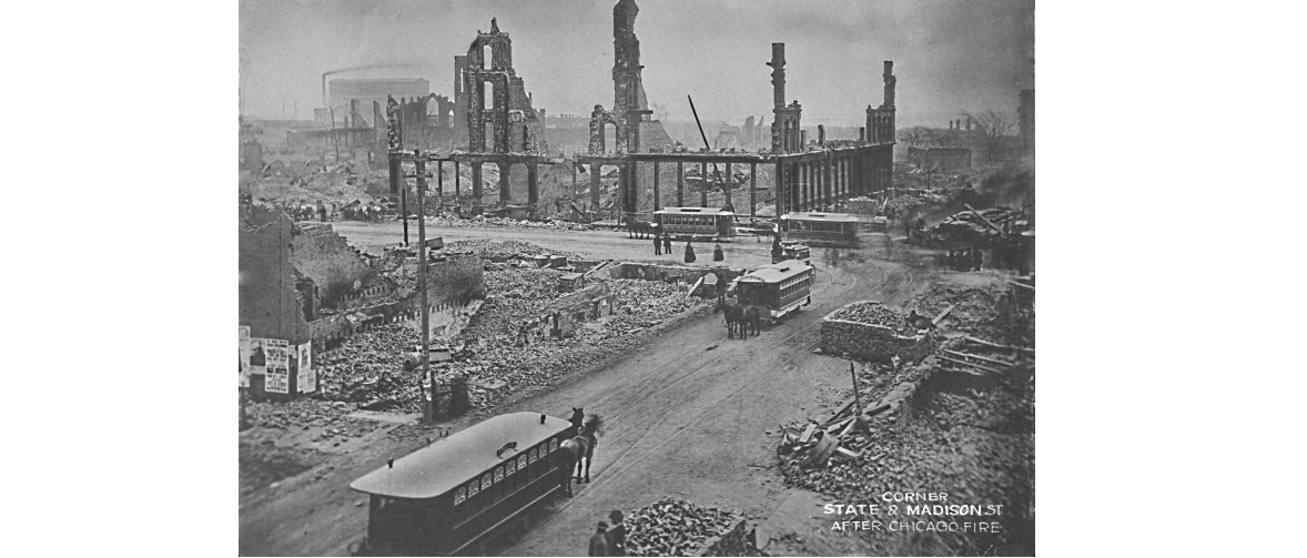 On 14 Sept 1874, the so-called State St. burnt district, from Van Buren to Harmon Ct., rebuilding slowly. Few buildings are already up &amp; most lots have activity. Streets crowded with horse teams taking debris to dump in lake. This pix is immediate post-fire of State &amp; Madison.