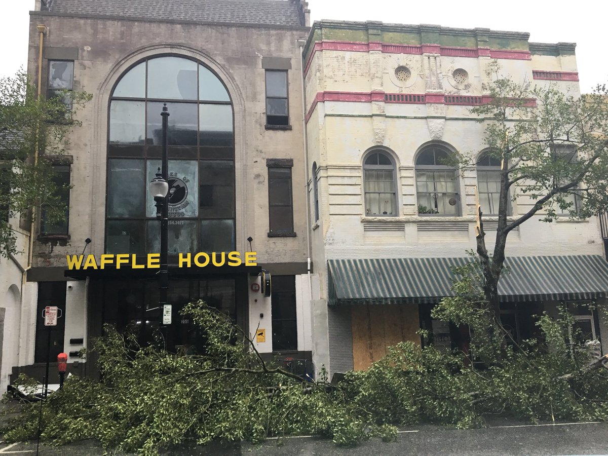 joey_cranney's tweet photo. Downtown Wilmington: trees bent and busted, at least one shop window shattered, street signs down, but no major damage https://t.co/B1AEaNHYyB