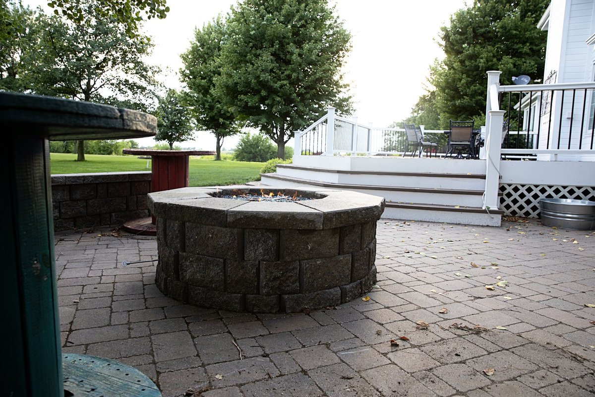 👍 Get ready for the change of season with a touch of style! A custom-built firepit like this one is all you need for those crisp fall nights! Check out smith-scapes.com. #outdoors #landscape #landscaping #outside #fire #firepit #nebraska #omaha