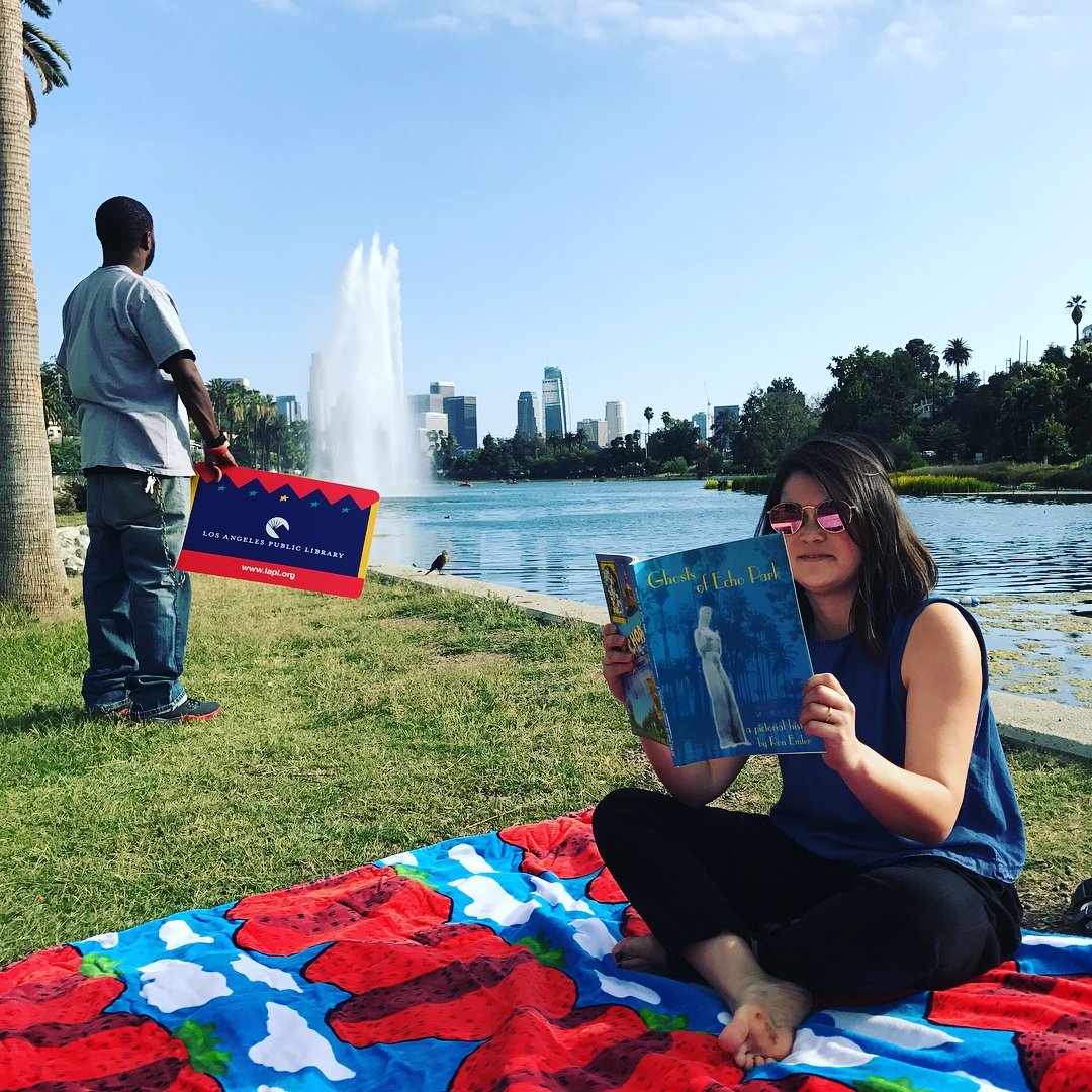 woman reading by echo park lake