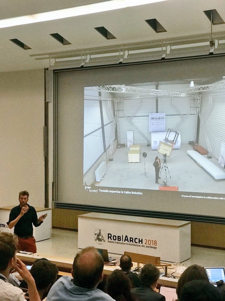 IAAC's tweet photo. #HappeningNow at #RobArch2018 in @ETH_en: IAAC's Master in Robotics &amp; Advanced Construction #MRAC director Alexandre Dubor giving a talk on "#OnSiteRobotics for Sustainable Construction"! If you're curious to know more about it, take a look here: https://t.co/ecP52laq8B https://t.co/CT010bvJ33