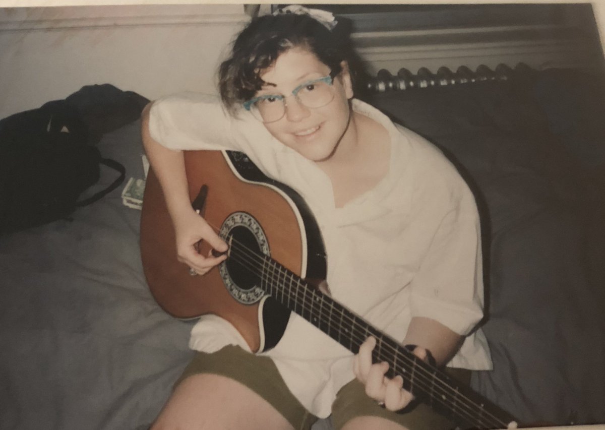 LisaLoeb's tweet photo. #InThe80sWe wore malachite retro glasses and played @OvationGuitars in @BrownUniversity dorm rooms, at least I did. Here I’m probably writing “Dance with the Angels.” #FBF https://t.co/BUkVnJfb38