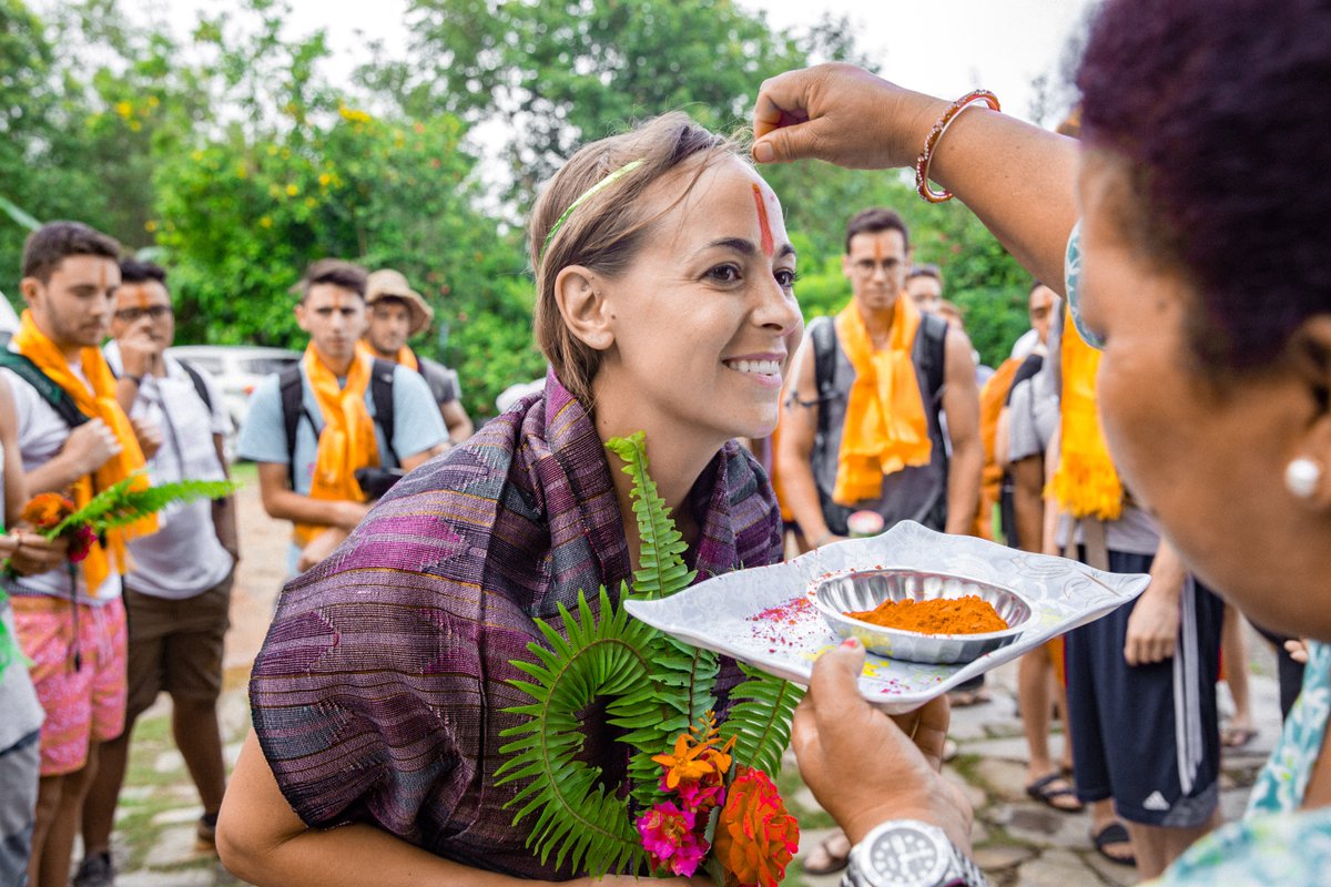 GIVEvolunteers's tweet photo. A Nepalese tradition of Sindoor is a symbol of good luck and celebration. The single red vertical line is a Hindu tika blessing, placed on the forehead, a location signifying spirituality and intuition. #givenepal #givevolunteers https://t.co/MGqUJcwpeR