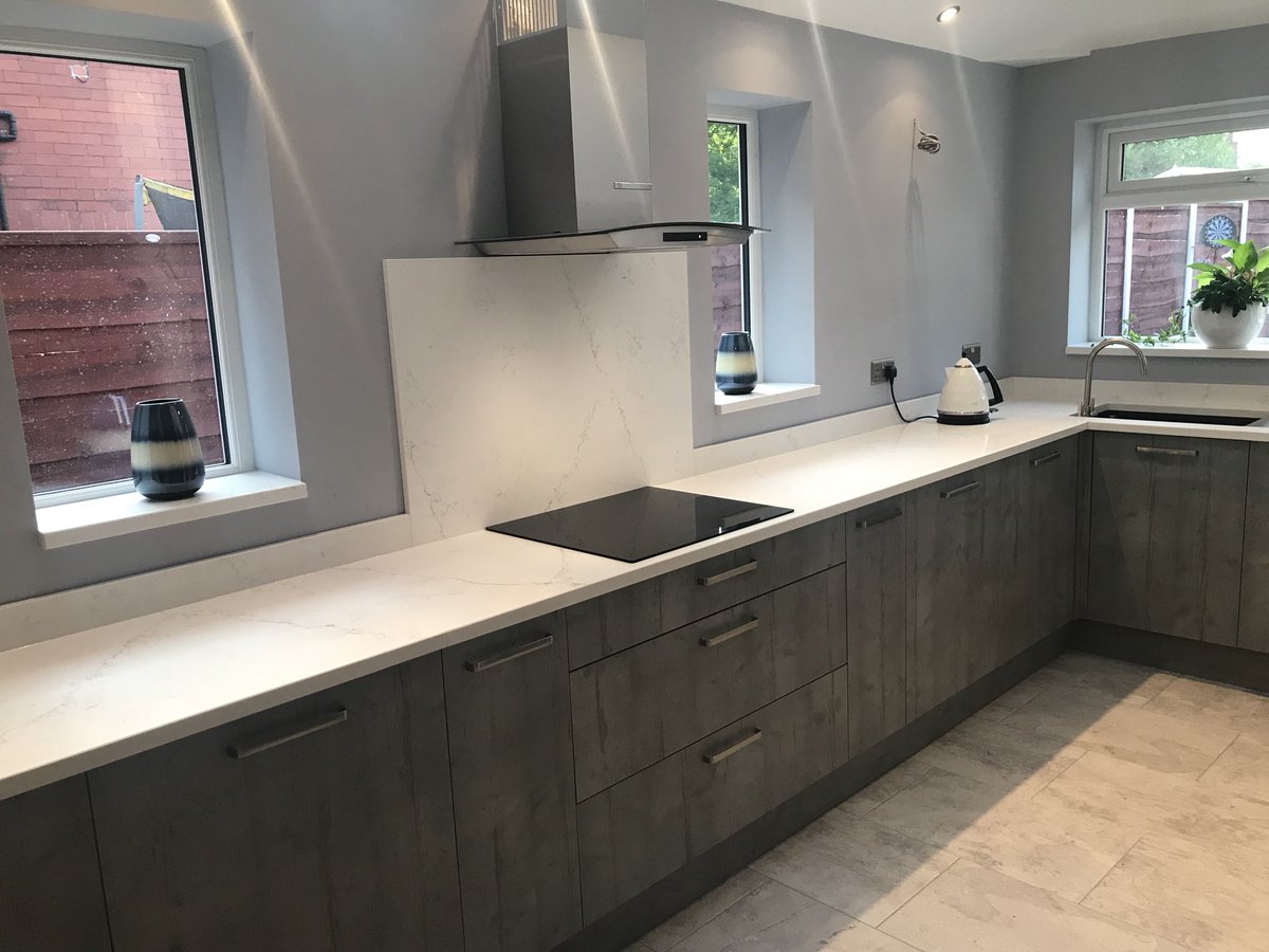 CAD_Kitchens's tweet photo. Concrete door with Quartz worktops, upstands, splashback and window ledges, Bosch appliances including integrated washer and dishwasher, single oven, combi, induction job and extractor, @franke_group sink and tap #kitchen #kitchendesign #kitchendecor #contemporarykitchen https://t.co/Uf5jwF6Umb