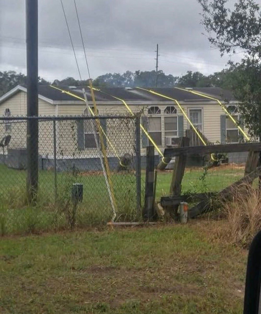 Weathering the hurricane with determination and grit. One home owners answer to the might of Florence....hope it holds up!!