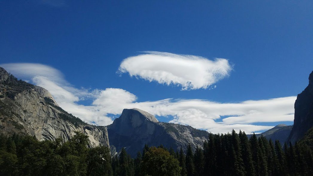 Lenticular clouds above Half Dome
