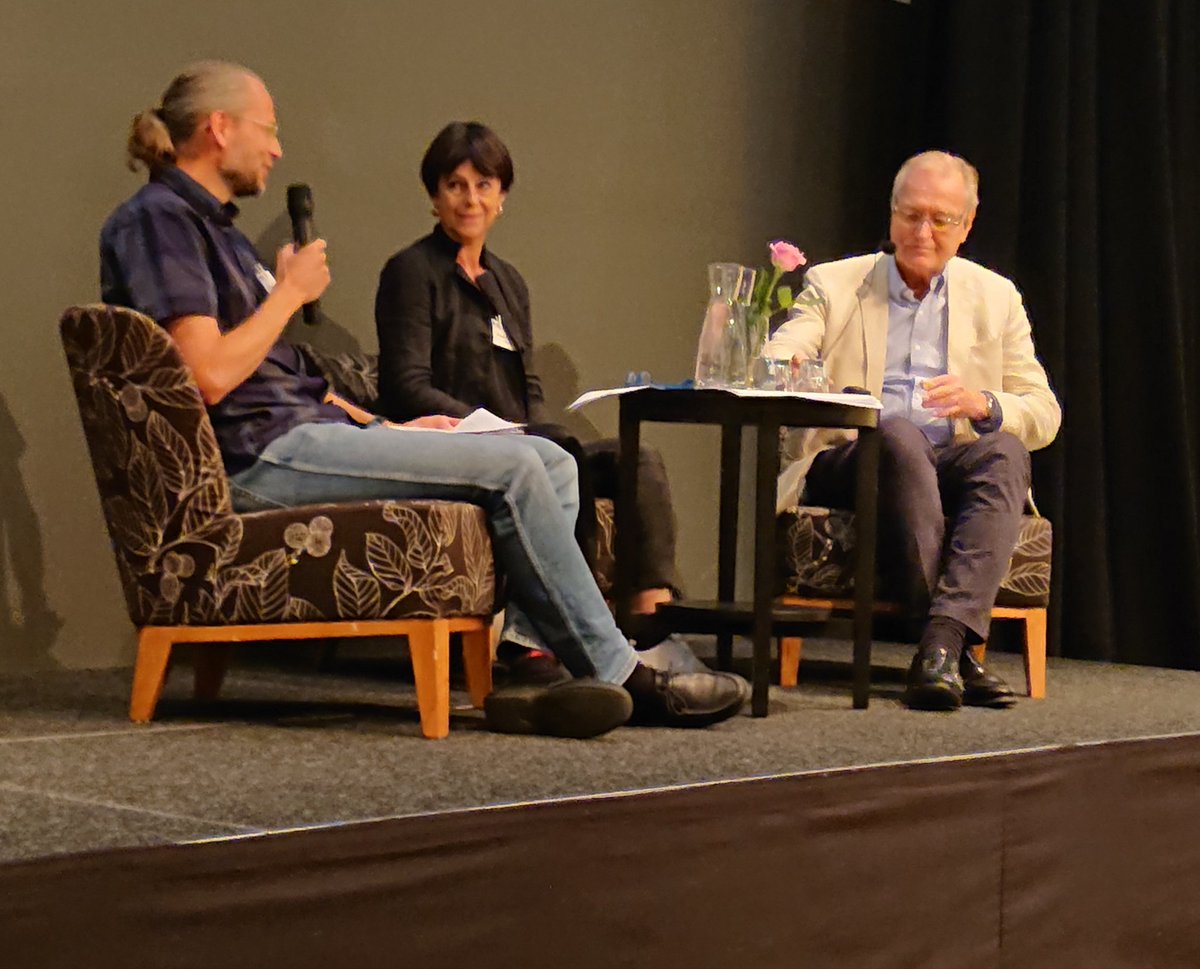 SLAMConf's tweet image. Moderator Jan Runesten discussing the ins and outs of a legal text with translation slammers Ingegärd Steen and Mattias Hovmöller #SLAMConf2018