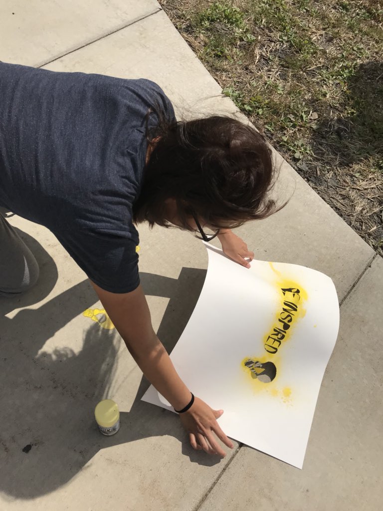 la_mpls's tweet photo. WHS Graphic Design 2 students create stencils and use spray chalk to spread messages of positivity at one of the school’s entrances. #wayzatacreates #WHSHereForYou #TrojanPride https://t.co/SqHdKzbMNh