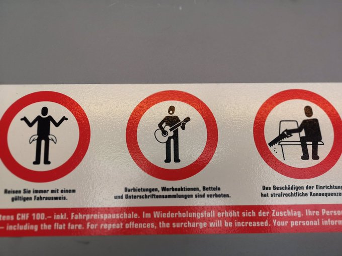 The public transit in Switzerland have these "no busking" signs, I would not be surprised if they put