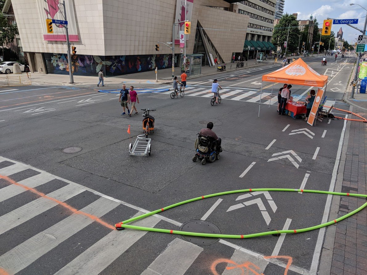 CycleToronto's tweet image. Catch our Campaigns &amp;amp; Engagement Manager Kevin setting up a #ProtectedIntersection Demo at @OpenStreetsTO tmw! Come on by Bloor &amp;amp; St George from 10-2 to experience a design that benefits all road users @BloorLovesBikes #BikeTO #OpenStreets #BuildtheGrid