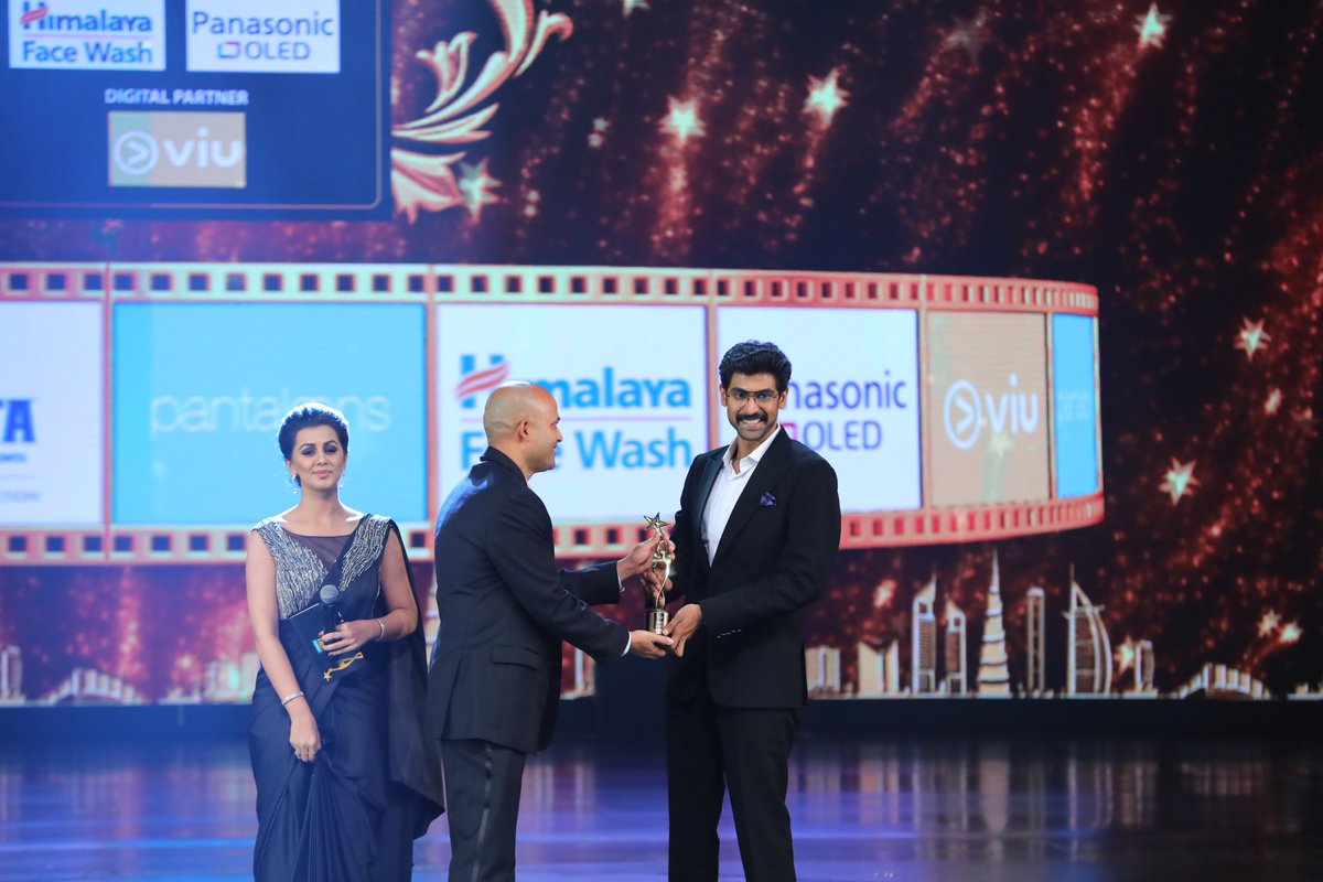 WorldRanaFans's tweet photo. Imagine receiving two achievements in one night?! That's what @RanaDaggubati had today. As well as Entertainer of the Year, he also took home the Best Actor in a Negative Role award for his outstanding performance as Bhallaladeva in #Baahubali2!! #PantaloonsSIIMA #SIIMA2018 💪 https://t.co/vg16BLgGJK