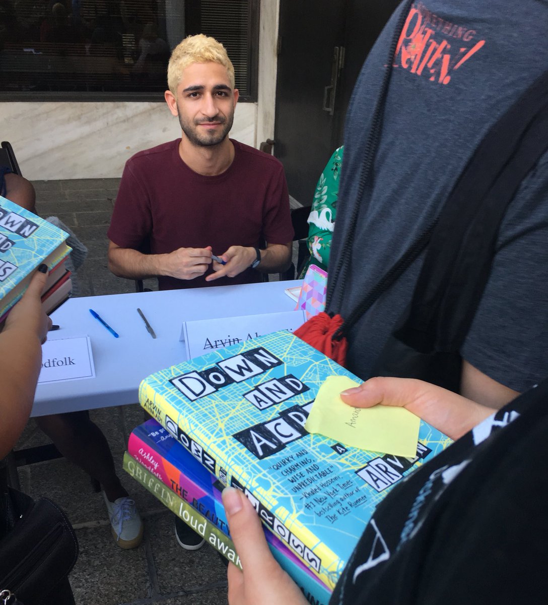 PenguinTeen's tweet photo. Signing line time for @arvinahmadi #BKBF18 https://t.co/K0GnhvDGPS