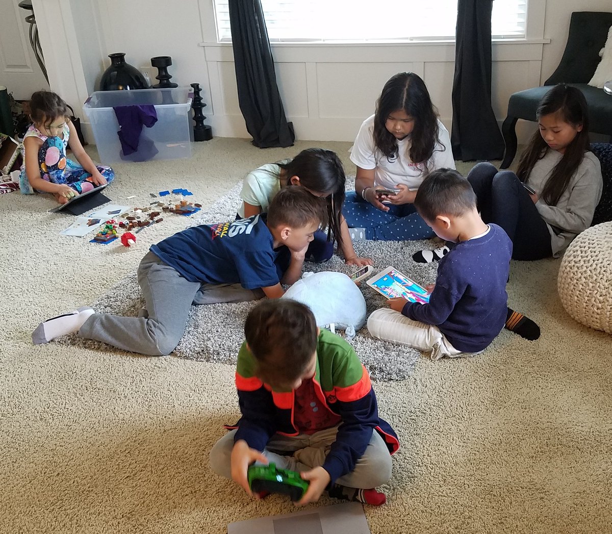 akimster's tweet image. The tech generation version of parallel play. 

These kids are 9YO and younger and moved between playing games and watching videos from phone to iPad to Surface Pro AND building analog Legos without skipping a beat. 

#techgeneration #brunchbunch