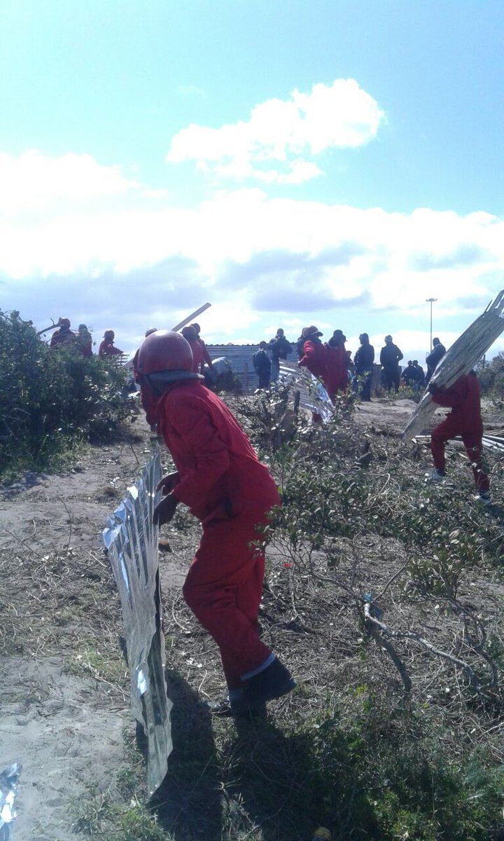In a joint operation, as instructed, members of The Red Ants demolish illegal structures in Zwelihle #Hermanus
#Peacefull
#Red_Ants_Tactical