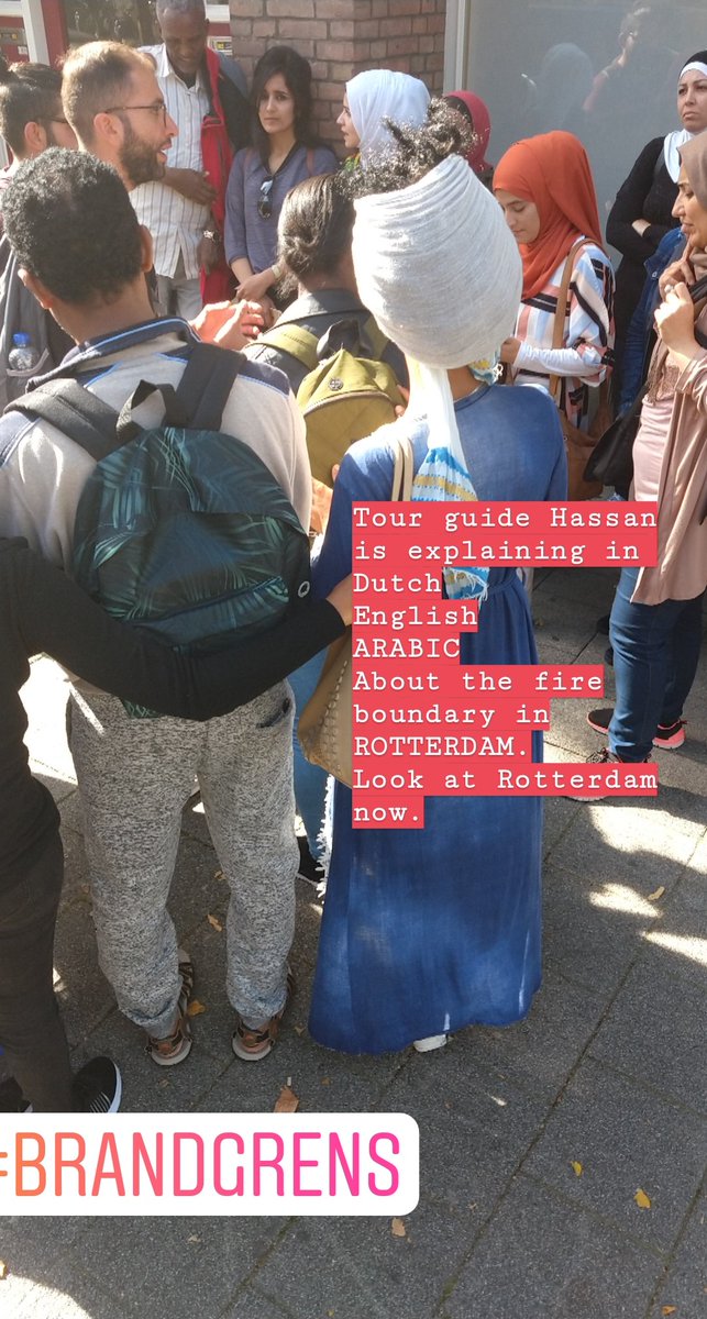 RotterdamPages's tweet photo. Vandaag weer een tour met statushouders. Tijdens een stop bij de brandgrens verteld onze gids Hassan in het Nederlands, Engels en Arabisch over het bombardement in Rotterdam. Kijk Rotterdam nu eens. #hope #Rotterdam @VluchtelingWerk #rotterdampages @RotDromers #landverhuizers https://t.co/iBky2zoXwF