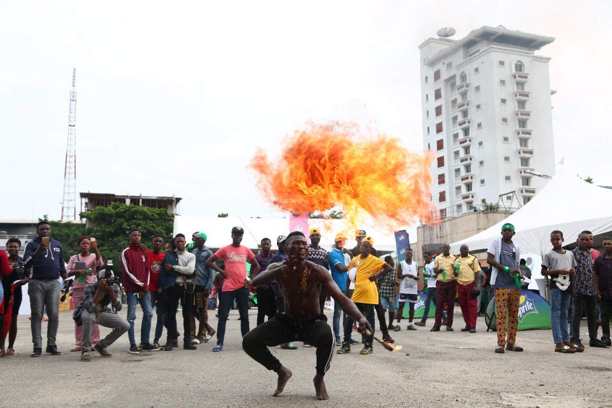 MTNNG's tweet photo. We were on our toes with some awesome fire breathing performances! 😱🔥🔥 Please do not try this at home! #FeetandTricks #AFFC18 #WhereFootballLives https://t.co/A9dpeUeLur