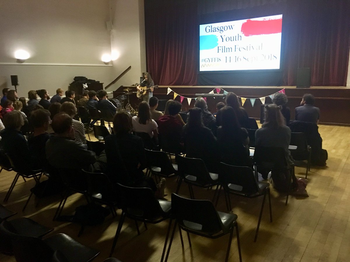 glasgowfilmedu's tweet photo. The GYFF Young Programmers introducing our Closing Gala film School of Rock at Blythswood Hall last night 🎸🎶 Also a big thanks to performers Vertigo and Mairi Macleod - both acts absolutely smashed it!  #GYFF18 #YOYP2018 https://t.co/mKEZOLwdKB