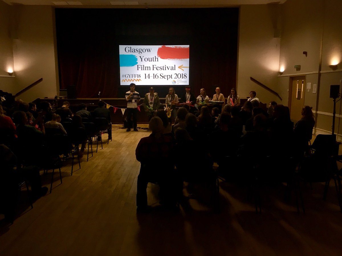 glasgowfilmedu's tweet photo. The GYFF Young Programmers introducing our Closing Gala film School of Rock at Blythswood Hall last night 🎸🎶 Also a big thanks to performers Vertigo and Mairi Macleod - both acts absolutely smashed it!  #GYFF18 #YOYP2018 https://t.co/mKEZOLwdKB