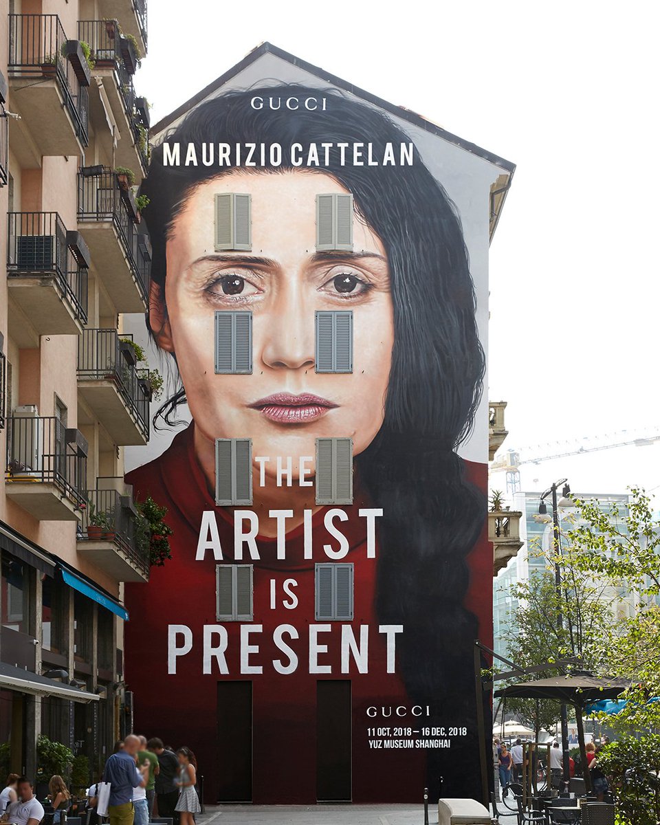 Gucci Japan En Twitter ミラノの Gucciartwall に 10 11から上海で開催される Mauriziocattelan によるアート展 Theartistispresent のポスターが登場 Ronan Gallagher が撮影した写真によるポスターは Marco Anelliによるマリーナ アブラモヴィッチの