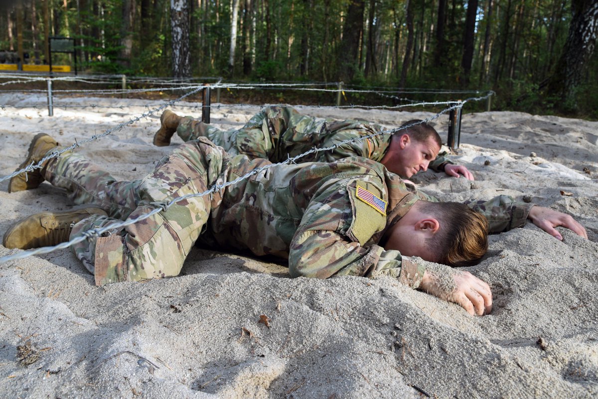 USArmy's tweet photo. #USArmy Soldiers assigned to various units from all over Europe low crawl through an obstacle course during an air assault training at @7thATC's Grafenwoehr Training Area, Germany, Sept. 11, 2018. 

U.S. Army photo by Markus Rauchenberger https://t.co/7UIsMTQnLV