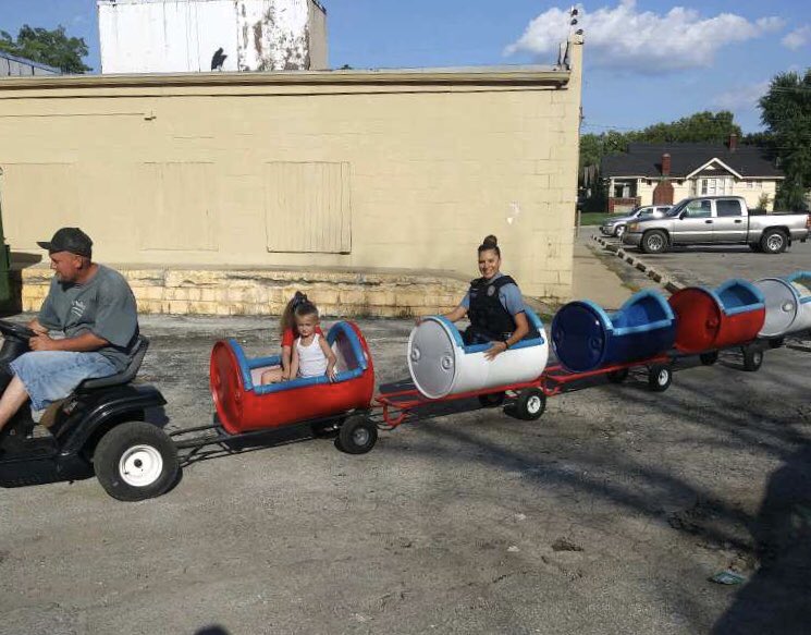 KCKPolice's tweet image. Officers Reliford and Vance were patrolling the area of 42nd &amp;amp; Strong when they observed kids riding in a motorized toy train. Officer Reliford could not resist in interacting with kids in all the train fun. 😂😂