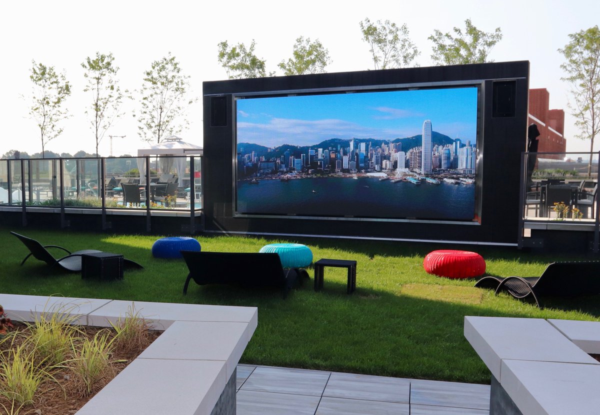 Avitecture's tweet image. With all the recent rain, we thought pictures of two 16-foot outdoor televisions on the 7th Floor Amenities Deck at 414 Light Street in Baltimore might cheer everyone up. Avitecture installed these direct-view LED video displays and outdoor sound systems.