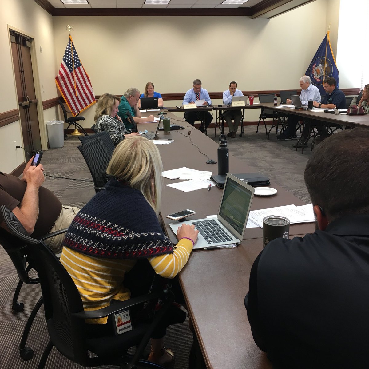 Participants attend the commission meeting