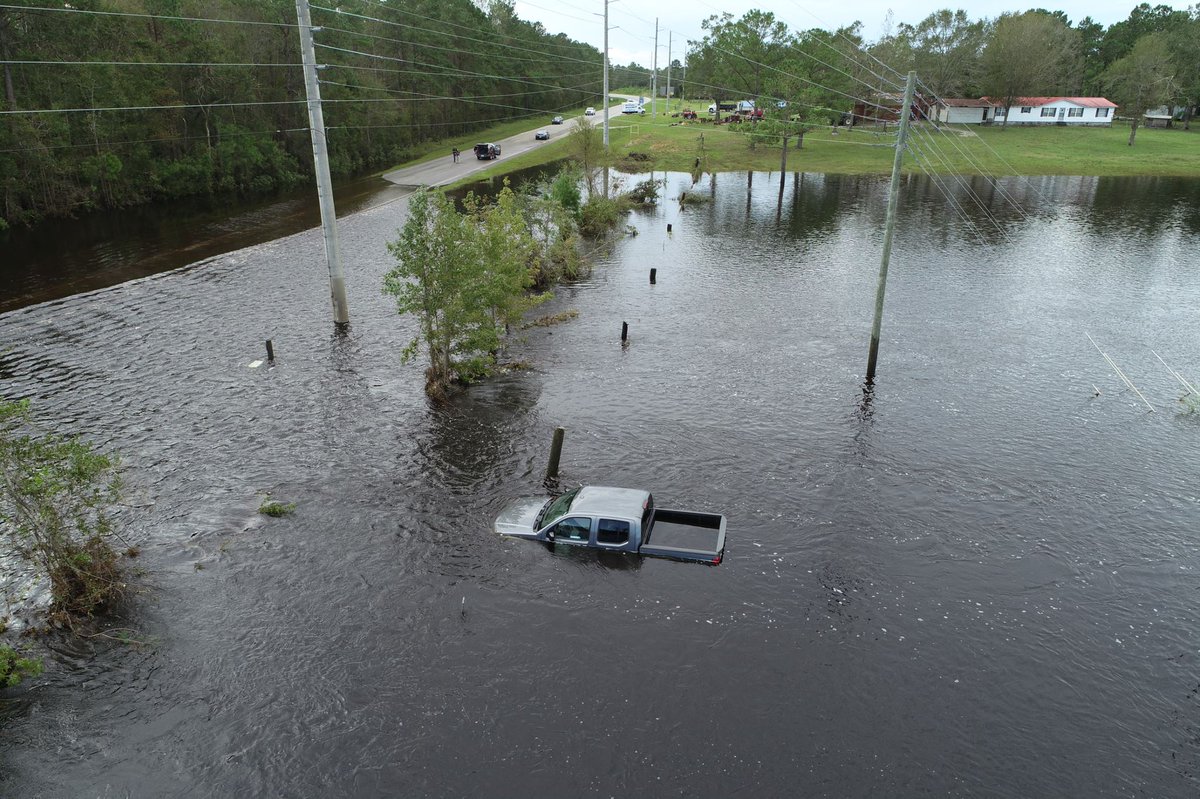 NCDOT's tweet photo. There are 1,050 road closures – incl. I-95 and 40, plus numerous highways &amp; primary routes. Waters are still rising, 2,200 people have been rescued. Never drive around barricades or into flooded/standing water. Visit https://t.co/Pbux7IDYBi (Pic: NC211/Brunswick Co.) #FlorenceNC https://t.co/DRJtgrxooI