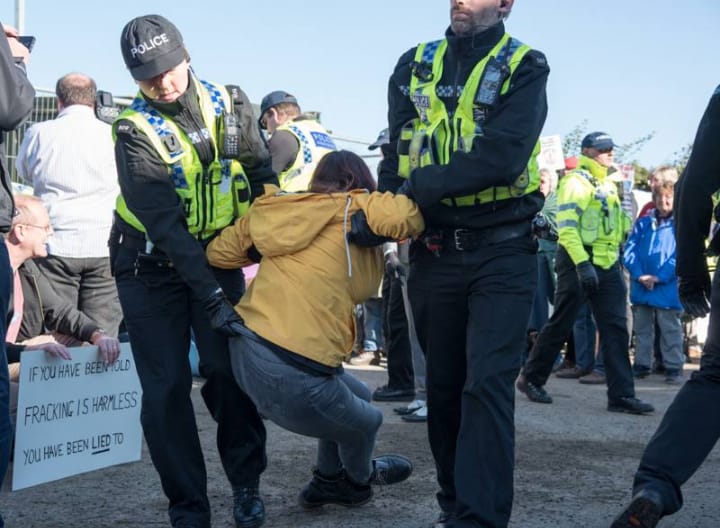 KMProtectors's tweet photo. Happy Anniversary to the protectors of Kirby Misperton. It's a year to the day since this assault on democracy took place, as people were ruthlessly dragged aside by @NYorksPolice to allow 1st #fracking vehicles to enter KM8 against the overwhelming wishes of residents. 
WE WON! https://t.co/jpLout68dz