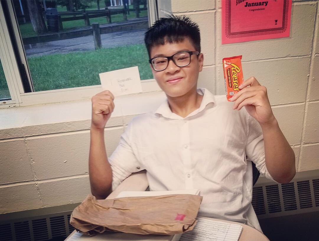 STMChancellors's tweet photo. An ‘19 shows off his prizes (Reese’s and a homework pass!) made in AP/ECE Economics during an activity designed to show the importance and impact of trading. #stmchancellors #gochancellors #realizeyourpotential #economics #apclasses #ececlasses #collegeprep https://t.co/tYUMP93Mdy