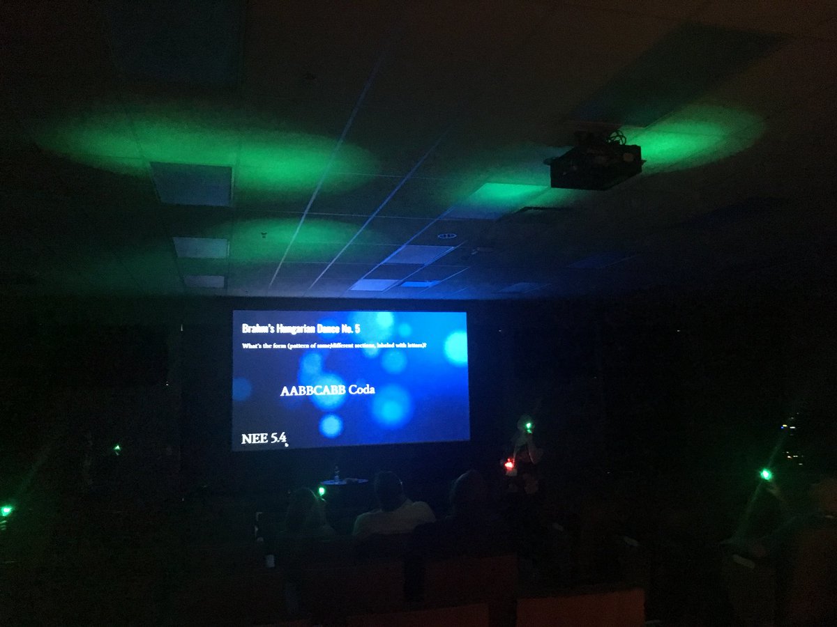 NEEAdvantage's tweet photo. For a second there we thought we had stumbled in to a dance party conference, but nope! Jennifer Patterson and Aaron Money are back at it, talking about NEE indicators in elementary music - this time in a darker room! #NEEConference https://t.co/jhJRd9351a