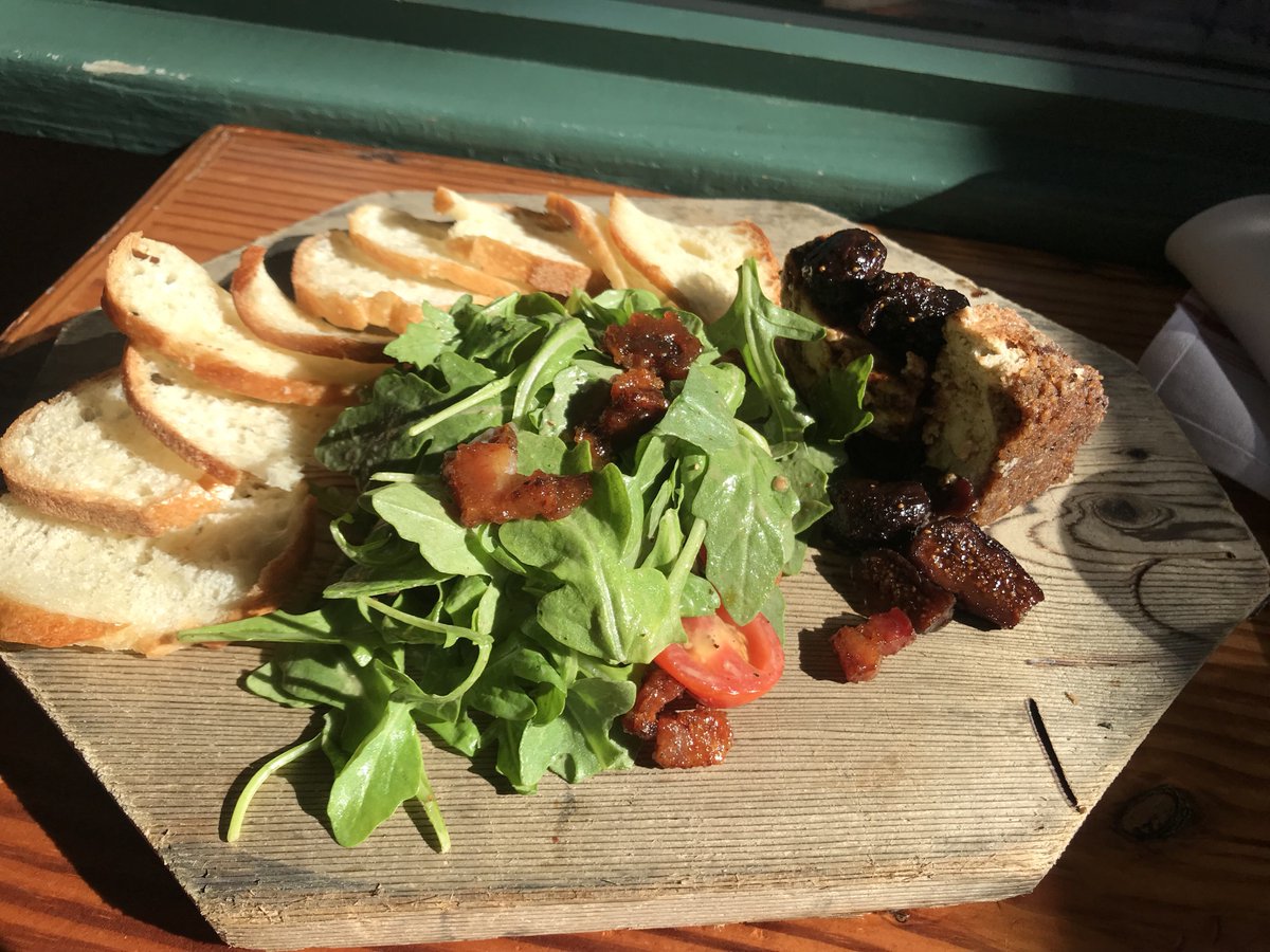Bleu Cheese Cheesecake with brandied figs, arugula salad with candied bacon lardons and cherry tomatoes, all served with crostini.