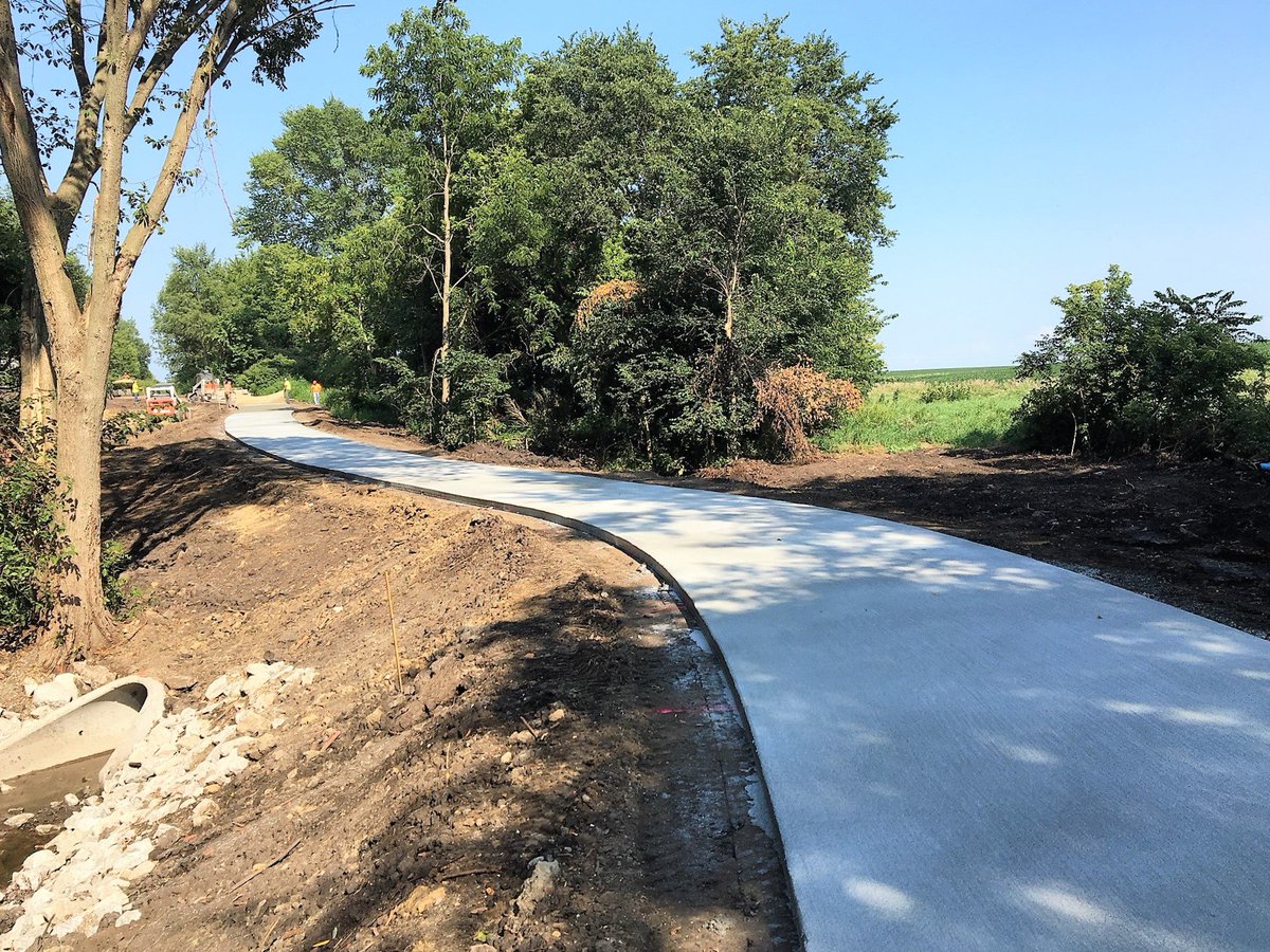 Dallas County Conservation shares exciting news and photos of the construction on the new "connector" trail going east from Perry, linking the Raccoon River Valley Trail and the High Trestle Trail. Expect to ride part of it this fall! Details: bit.ly/2MSyQaY.