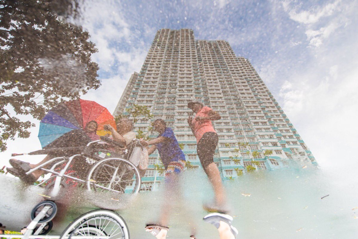 mindefsg's tweet image. A “lucky shot” for photo enthusiast Ahmad Iskandar turned out to be the winning capture of this year’s #WeAreTotalDefence Photo Challenge: a rain-puddle reflection of #Singapore&apos;s community spirit. 
More on the top 3 winning entries: mindef.sg/tdphoto18